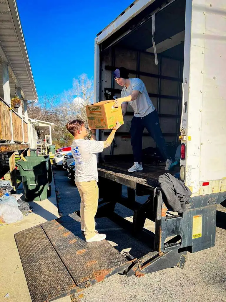 C&R mover stacking boxes and bins inside the box truck